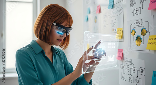 Woman analyzes augmented reality data with smart glasses near strategy whiteboard, exploring future technology.
