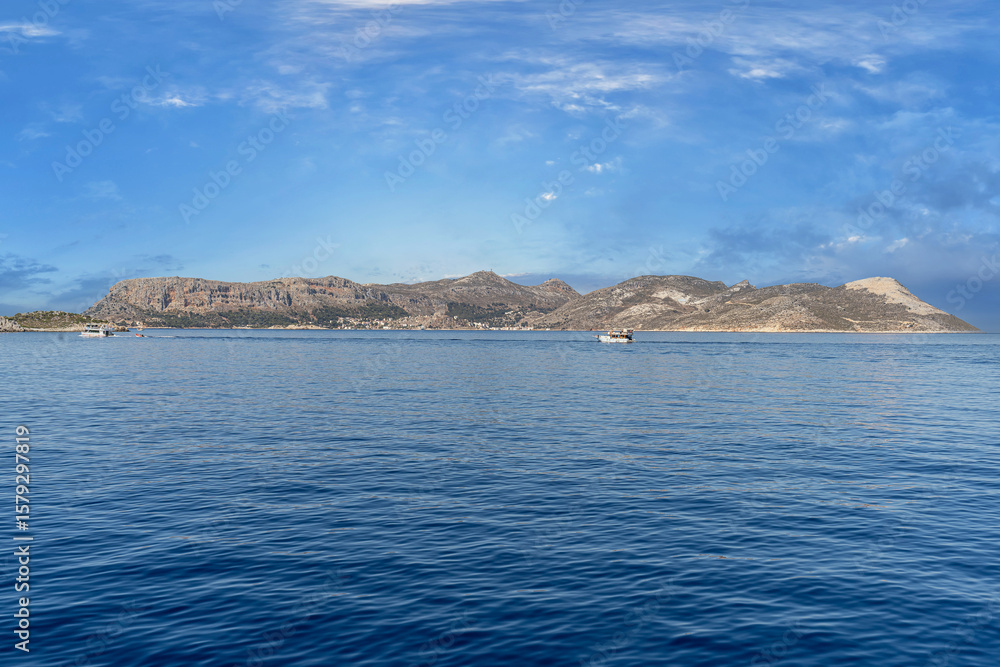 Fototapeta premium A beautiful view from the sea of Meis-Kastellorizo, a Greek island in the Mediterranean famous for its Lego-like structures.