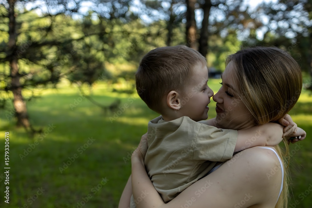 In a peaceful park, a mother holds her young son closely, both enjoying a joyful moment together. Sunlight filters through the trees, enhancing their bond. In a peaceful park, a mother holds her young son closely, both enjoying a joyful moment together. Sunlight filters through the trees, enhancing their bond.