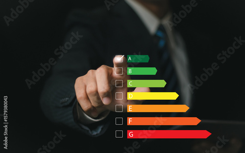 Home Improvement concept, Home Energy Efficiency, Eco-Friendly Home Improvement, Cost Savings and Green Energy Costs. businessman who chooses to use green energy saving in home