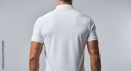 Wallpaper Mural Back view of a man wearing a clean white polo shirt with short sleeves against a neutral background Torontodigital.ca