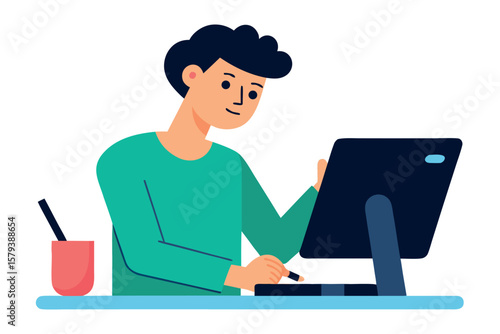 Young man working on a computer with a stylus and drawing tablet