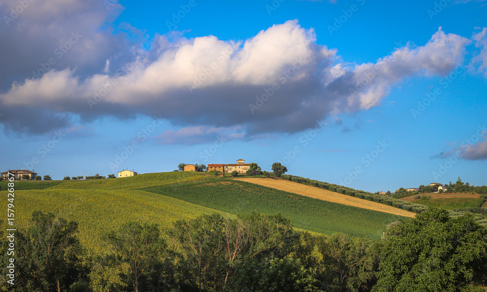 Naklejka premium Beautiful landscape with countryside, mountain and cloudy sky, Marche region, Italy