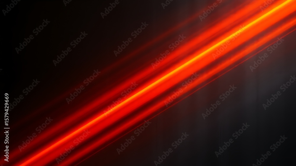Fototapeta premium Abstract industrial design featuring glowing orange streaks on a sleek dark metal surface.