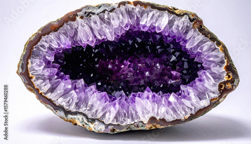 Stunning amethyst geode featuring vibrant purple crystals. Evokes feelings of serenity, luxury, and natural beauty. Ideal for designs about wellness, geology, and interior decor.