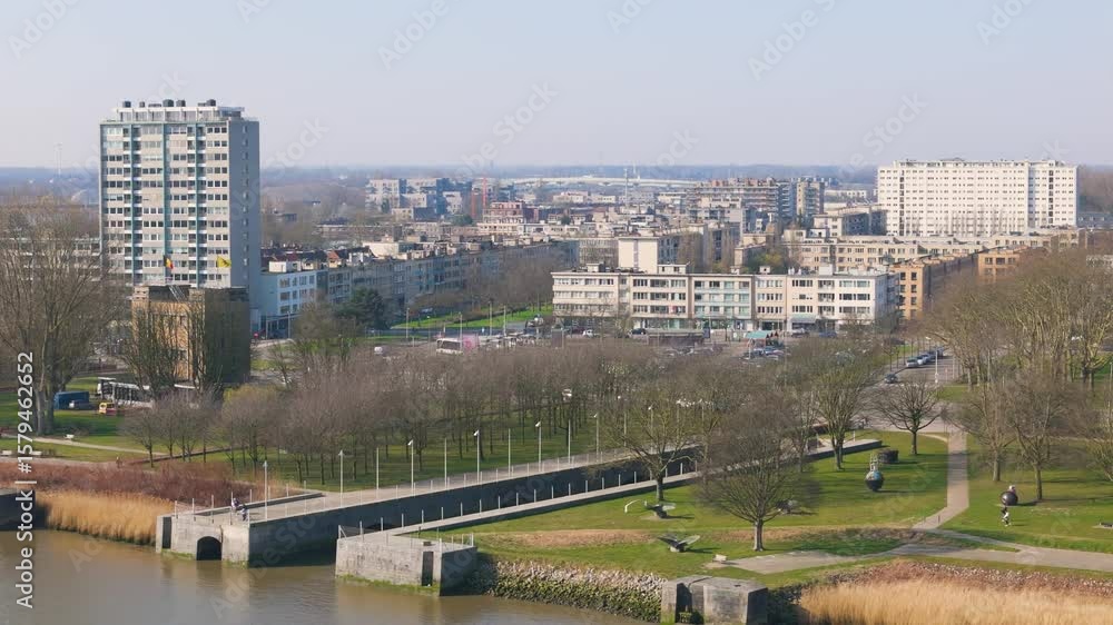 city antwerp belgium residential buildings green parks below yellow grass along banks scheldt river scenic urban area infrastructure journey aerial drone shot view city antwerp belgium residential buildings green parks below yellow grass along banks scheldt river scenic urban area infrastructure journey aerial drone shot view