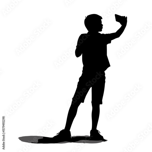 Boy taking selfie in silhouette against a white background  