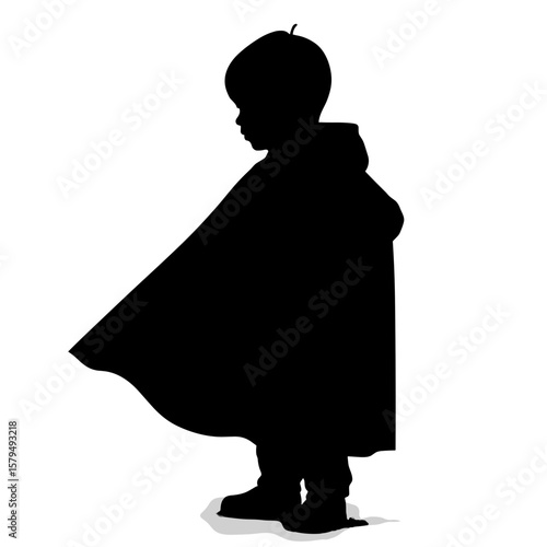 Child in superhero cape silhouette standing confidently  