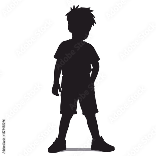 Silhouette of young boy standing confidently in casual clothing  