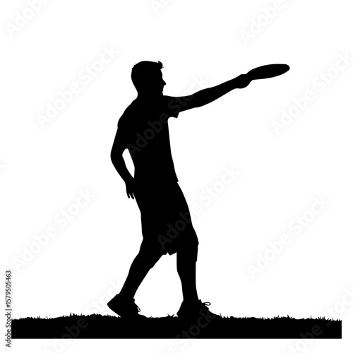 Man throwing frisbee in silhouette on grass background  