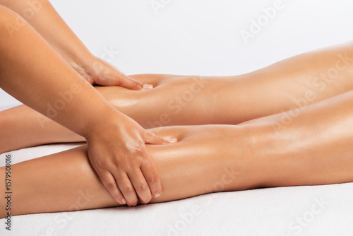 Wallpaper Mural The masseur makes a massage on the legs, waist and hips in the spa. Overweight treatment, body sculpture. The concept of cosmetology and massage. Torontodigital.ca