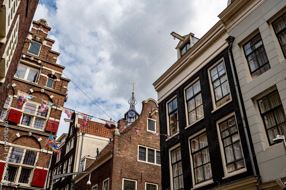 Fototapeta premium Amsterdam and the canals that run through it during a summer day