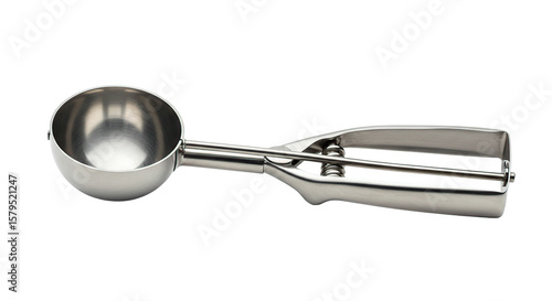 A close up shot showcasing a shiny metal ice cream scoop against a stark black background image detail