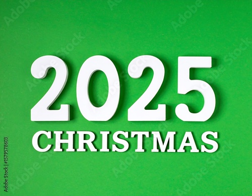 White numbers 2025 over Christmas on a green background