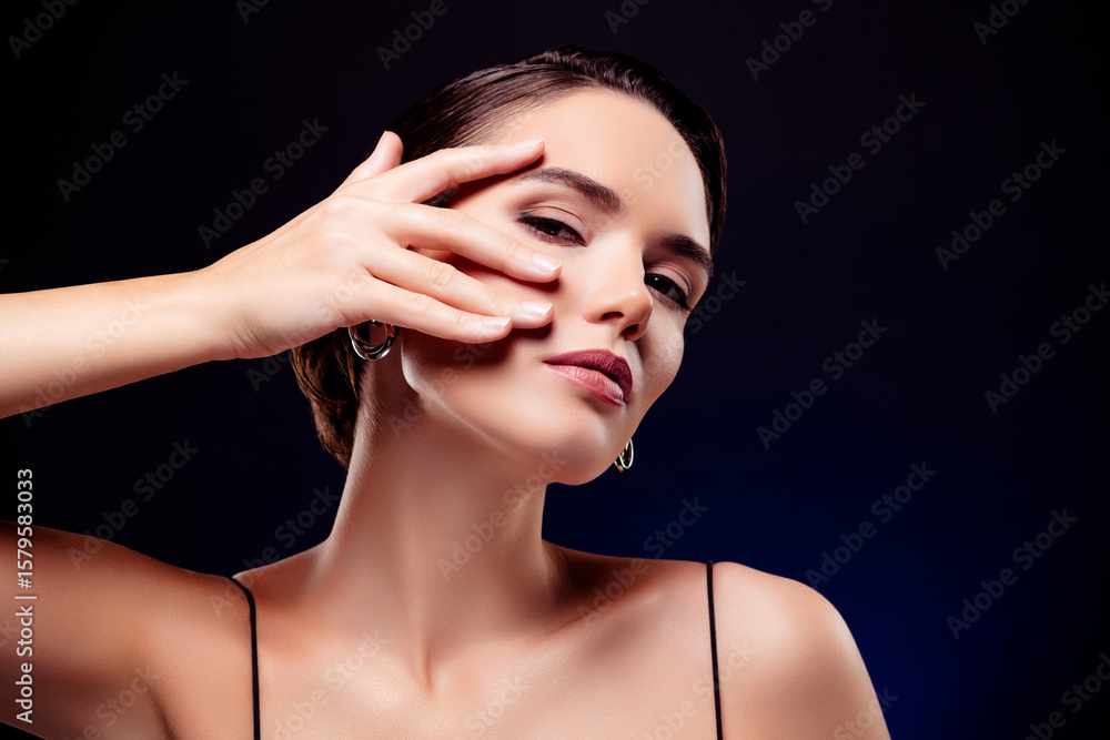 Obraz premium Photo portrait of attractive young woman touch soft skin face lifting wear dress isolated on black color background