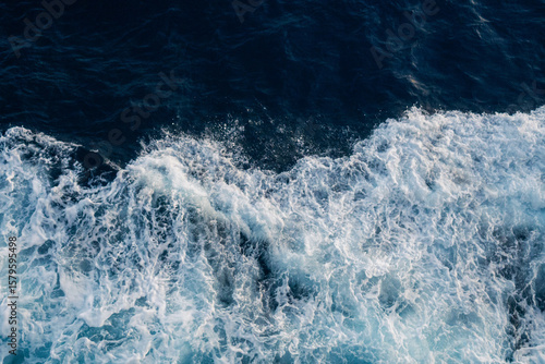 Sea water splash with foamy wave. Water surface texture. Tropical islands ferry travel. Cruiseliner trail. Ocean background. White water of sea. Marine travel banner template. Seaside vacation concept