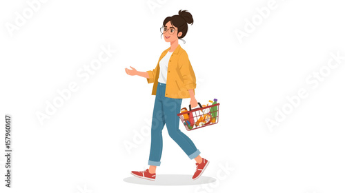 Young woman walking with a shopping basket full of colorful groceries, dressed casually in a jacket and jeans on a white background.