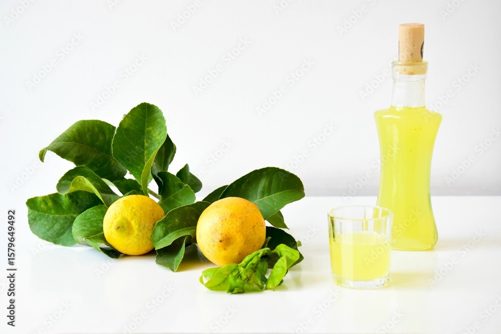Fototapeta premium Composition of lemons with limoncello
