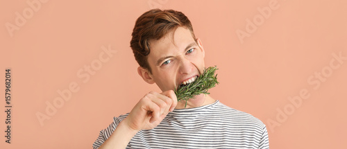 Angry young man eating fres...