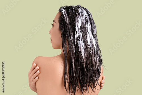 Young woman with hair mask ...