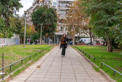 Wallpaper Mural Young woman walking around the city and the parks in Autumn time. Torontodigital.ca