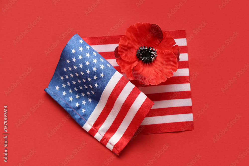 Obraz premium Flag of USA and poppy flower on red background. Memorial Day celebration