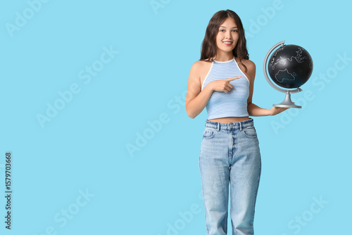 Young Asian woman pointing ...