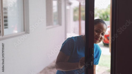 Asian health care worker arriving at elderly woman home, home nurse, home care service concept
