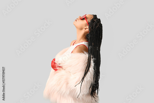 Konstfotografi Stylish African-American woman with braids on light background