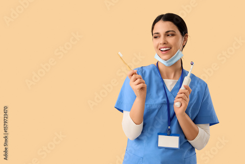 Female dentist with toothbr...