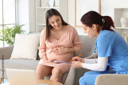 Young pregnant woman with d...