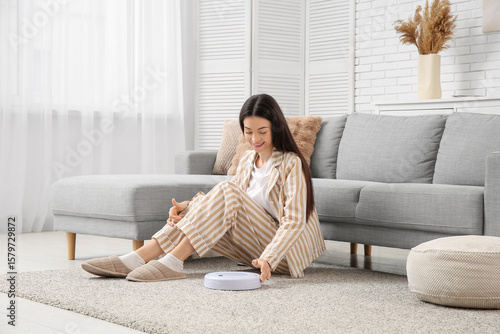 Young woman in pajamas with...