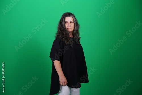 Unedited Portrait of Woman’s Face Expressing Various Emotions – Green Studio Background