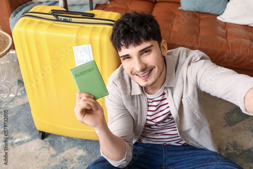 Male tourist with passport ...