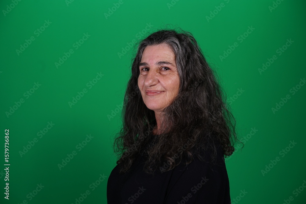 Obraz premium Unedited Portrait of Woman’s Face Expressing Various Emotions – Green Studio Background