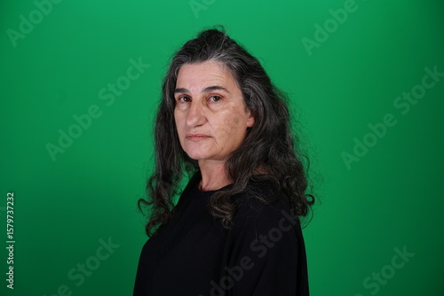 Unedited Portrait of Woman’s Face Expressing Various Emotions – Green Studio Background