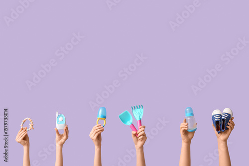 Hands holding baby accessor...