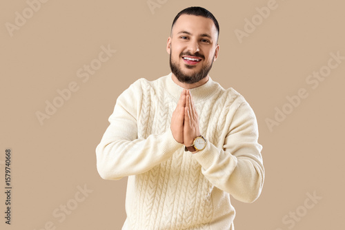 Thankful young man pressing...
