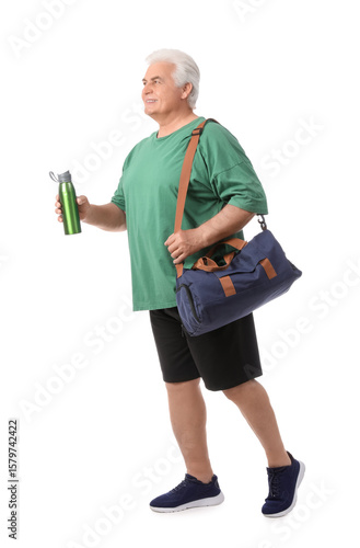 Senior man with sports bag ...