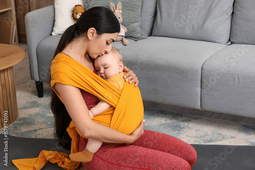 Sporty mother kissing her b...