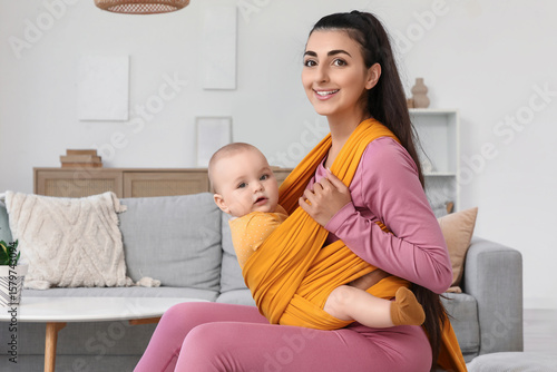 Sporty mother with her baby...