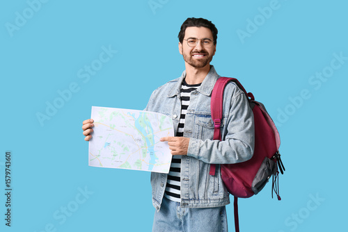 Young male tourist with bac...