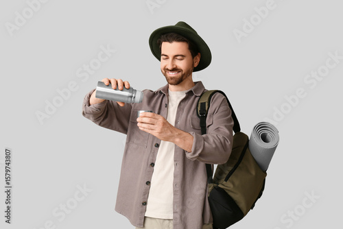 Young male tourist with bac...