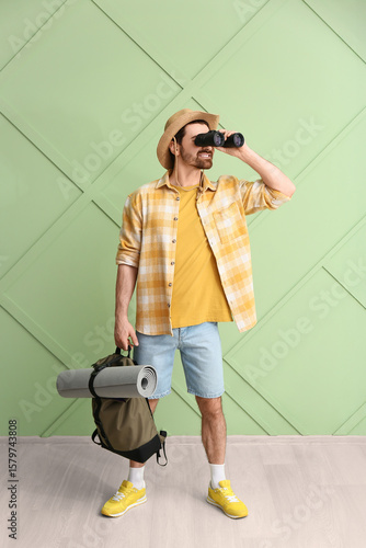 Young male tourist with bac...