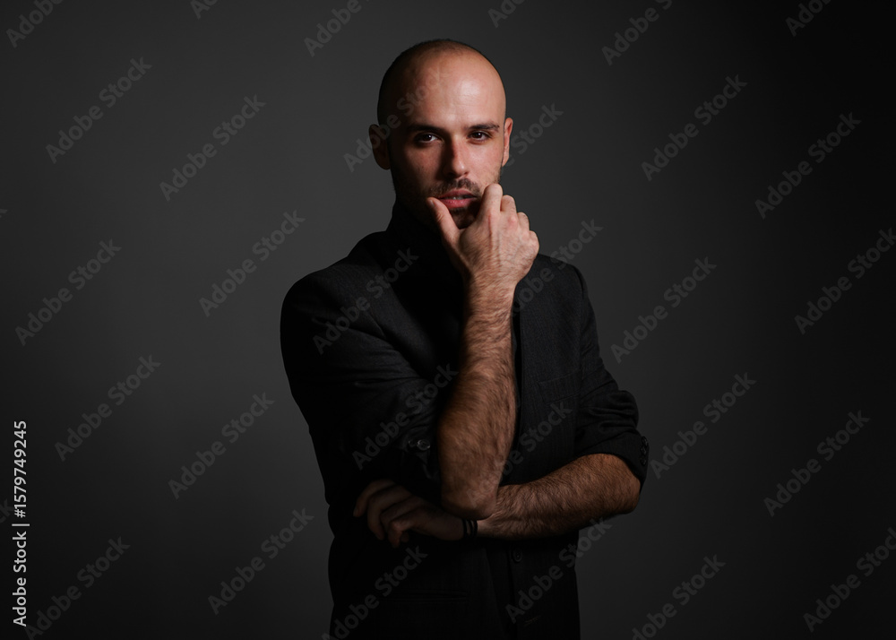 Young man with a variety of emotions, wearing a white t-shirt standing against a green background. Studio shot with copy space. Young man with a variety of emotions, wearing a white t-shirt standing against a green background. Studio shot with copy space.
