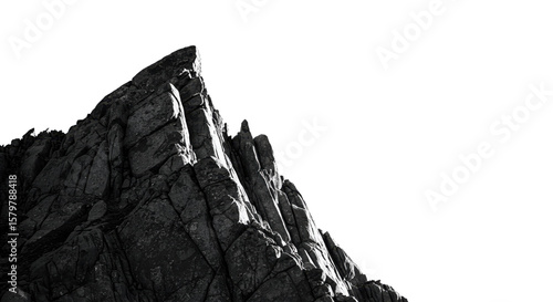 Striking monochrome showcases a jagged mountain peak against a contrasting black background creating a dramatic outdoor landscape.