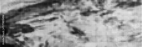 Abstract halftone dots texture background. Grunge black and white backdrop.