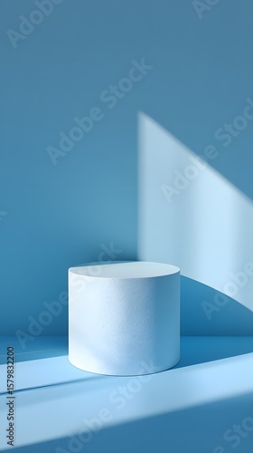 Shadowed pedestal in front of a gentle pastel blue gradient wall, empty mockup