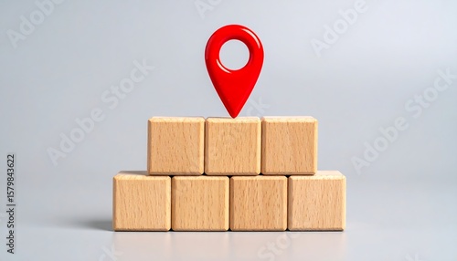 Wooden Blocks with Red Pin Location on Matte Background