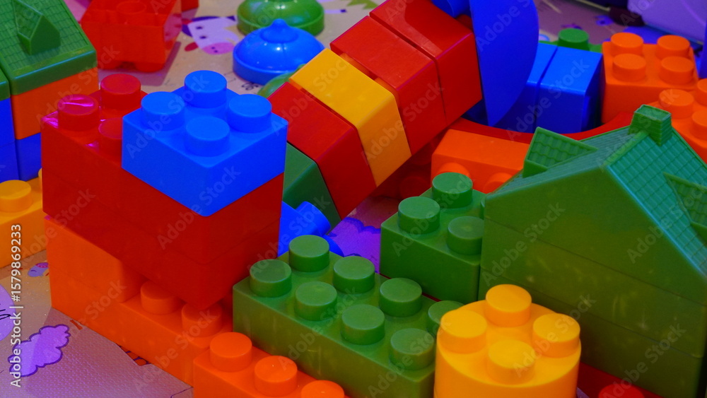 Obraz premium High-resolution image of colorful building blocks arranged in various shapes, perfect for children's toys, creativity, and educational themes.